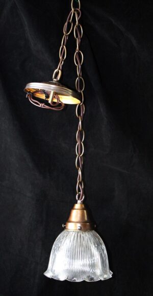 Antique clear prism glass pendant light with a chain and fitted metal canopy, shown hanging vertically with the ribbed glass shade below.