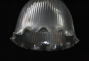 Clear Holophane glass pendant shade with vertical prism ribs and a scalloped lower edge.