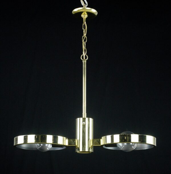 Mid century modern pendant light with two circular arms and a polished brass finish, shown hanging with a central stem and chain.