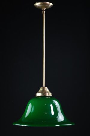Pendant light with a green encased glass shade and antique brass pole.