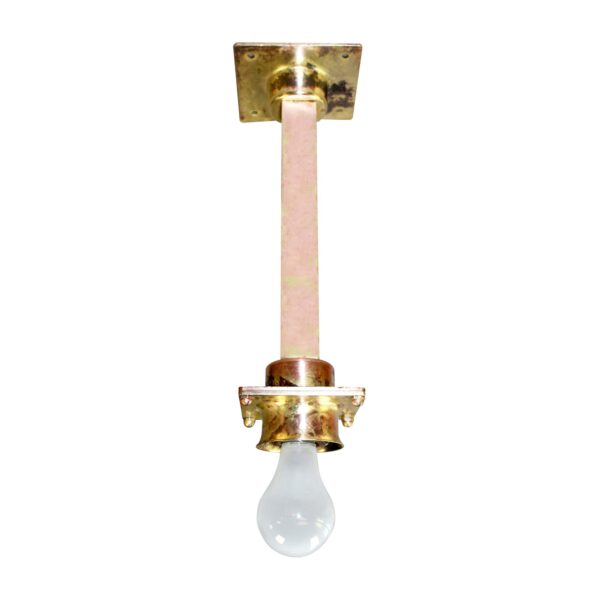 Vintage industrial pendant light with a long central stem, brass mounting hardware, and an exposed bulb socket.