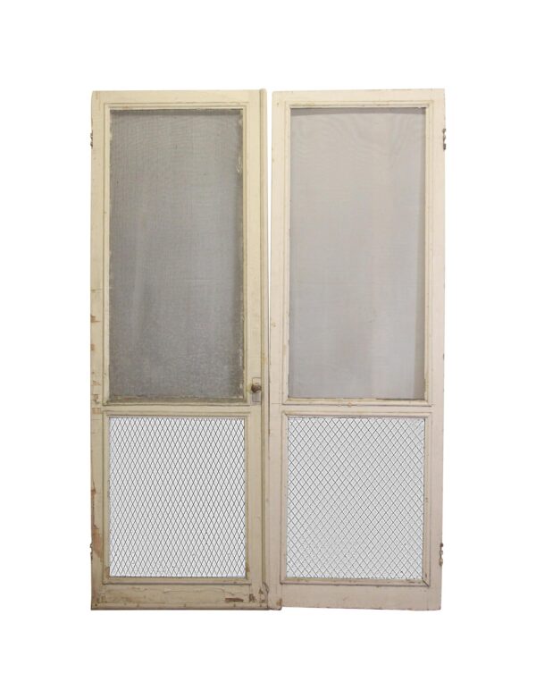 Pair of white wood screen doors with two tall screened panels and diamond mesh lower sections, shown front on and priced as a double.