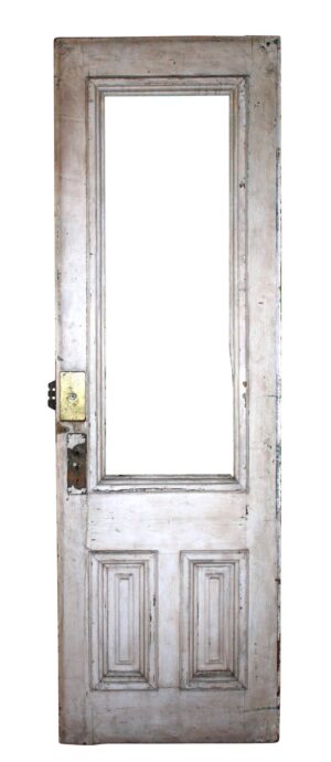 White entry door with one tall glass opening and two lower raised panels, shown without the glass inset and with visible hardware on the left side.