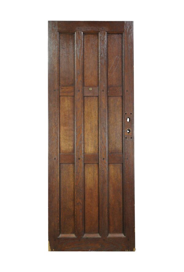 Arts and Crafts oak entry door with nine panels and a dark wood tone, shown front-on with door hardware openings on the right side.