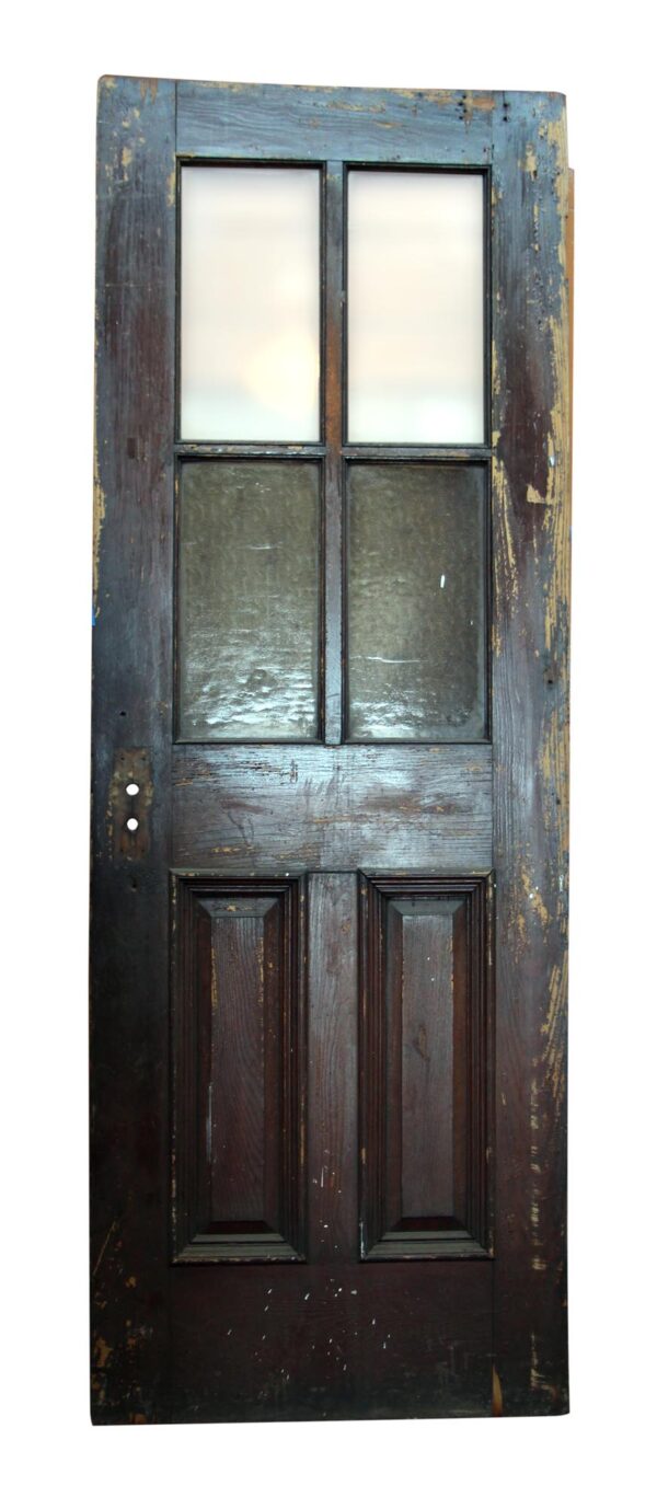 Dark wood tone door with four glass panels and six raised lower panels, shown upright and centered.