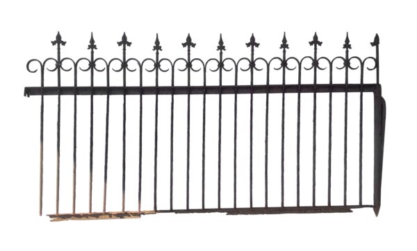 Antique wrought iron fence section with fleur de lis finials and curled top details, shown with rust damage along the bottom bar.