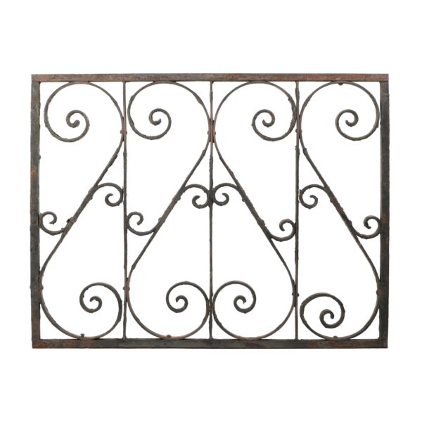 Antique wrought iron panel with a rectangular frame and four vertical sections of scrollwork.