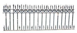 Wrought iron fence section with split finials and cast detail, shown in a straight-on view with pointed tops and long vertical bars.