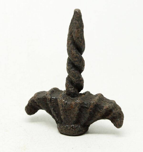 Antique Arts and Crafts cast iron fence finial with a twisted pointed top and worn black finish.