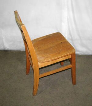 Classic wooden chair with a ladder back and medium wood tone, shown in side view.