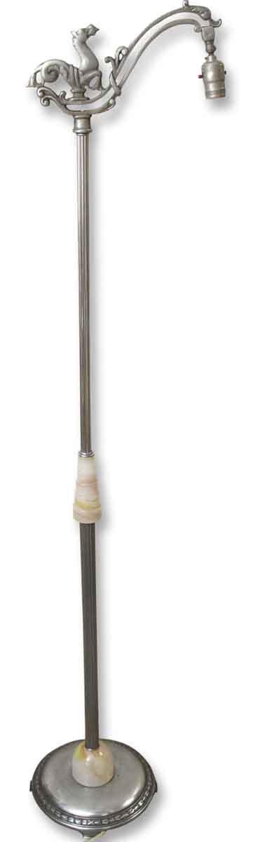 Antique floor lamp with a horse motif at the top, visible marble details on the shaft and base, and a hanging socket.