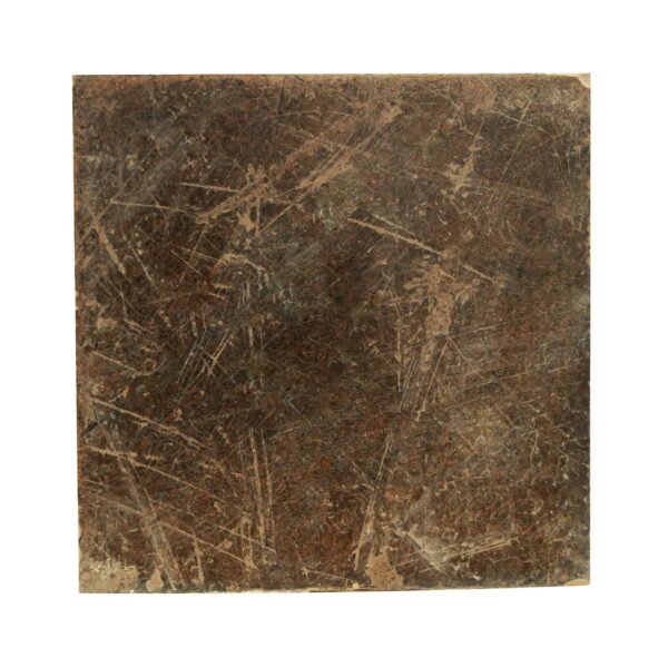 Square ceramic floor tile with a grayish brown mottled surface and visible age-related scratches and minor edge chips.