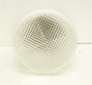 Close-up of a semi flush mount light with a white and clear glass shade.