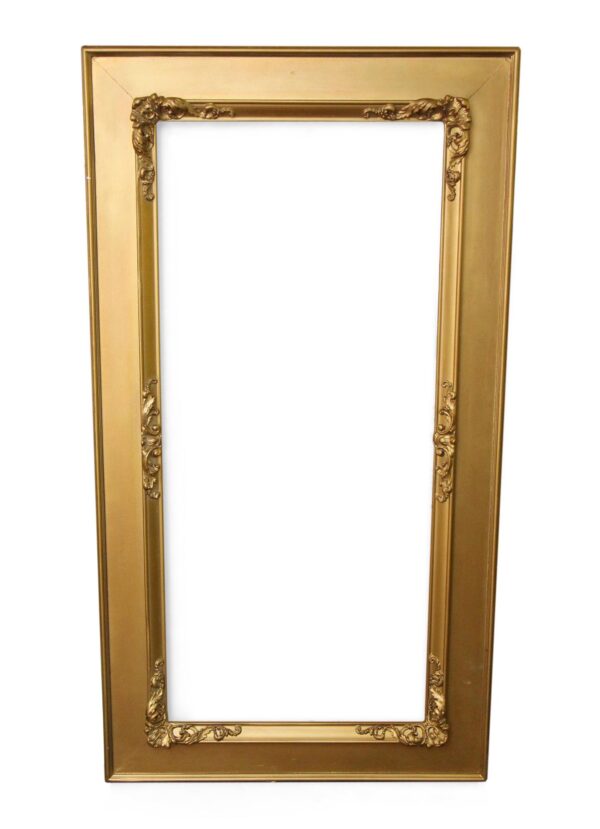 Ornate gold painted mirror frame with decorative carved detailing and a tall rectangular opening.
