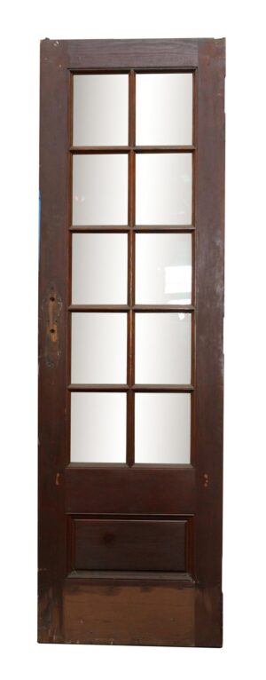 Narrow wood door with 10 square lites and one lower panel, shown with the dark wood side facing forward.