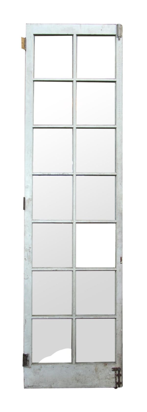 Tall white wooden door with 14 glass panes, shown with missing glass in the lower left pane and visible antique hardware.