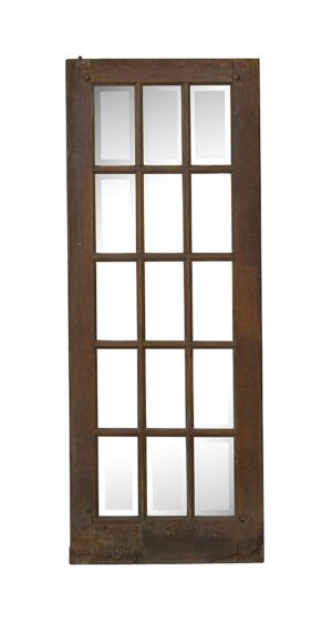Dark wood tone French door with 15 beveled glass panes arranged in a vertical grid.