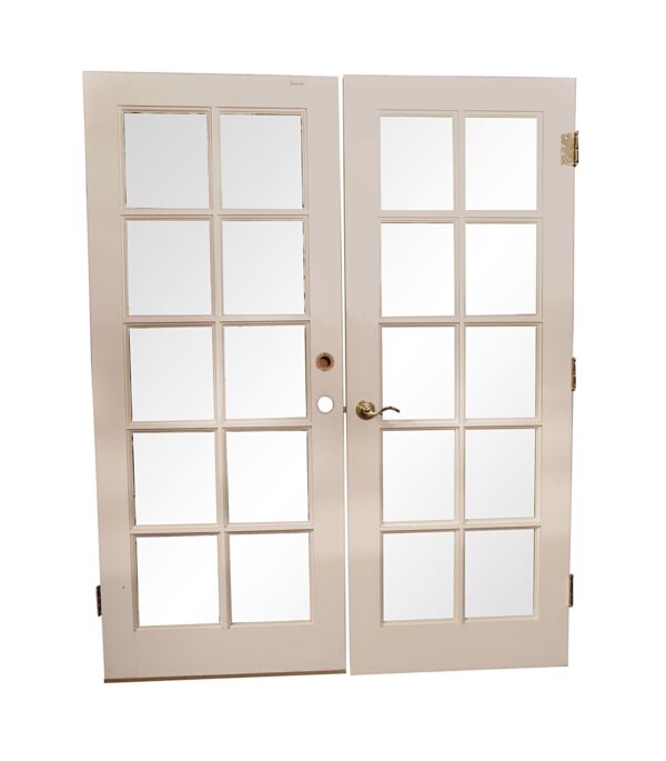 White double French doors with 10 glass panes per door, a lever handle, and visible hardware.