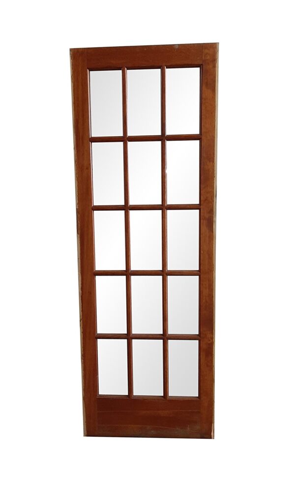 Dark wood tone French door with 15 glass lites and visible wood wear, shown straight on.