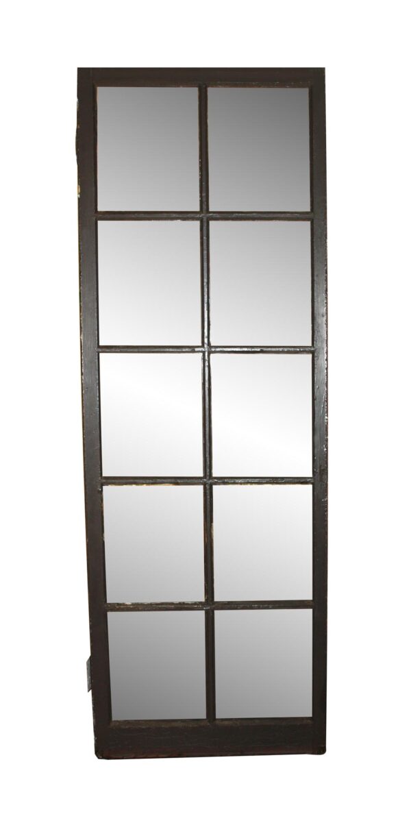 Dark wood tone French passage door with 10 glass panes, shown upright in full view.