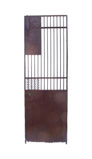 Antique iron elevator cage gate with vertical bars, a solid lower panel, and an original brass knob, shown full length with visible wear on the bottom panel.