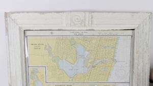 Framed nautical map of East Coast New Jersey showing part of Shark River, displayed in a white crackled paint wood frame.