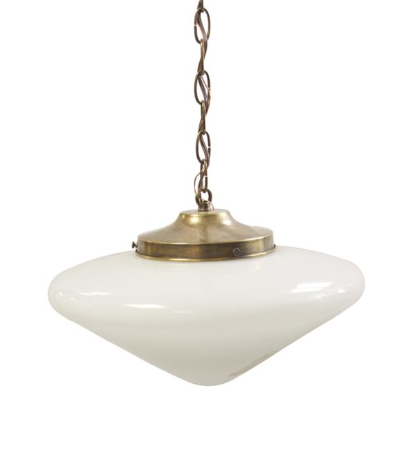 Mid-century schoolhouse pendant light with a white milk glass cone shade and an antique brass chain fitter.