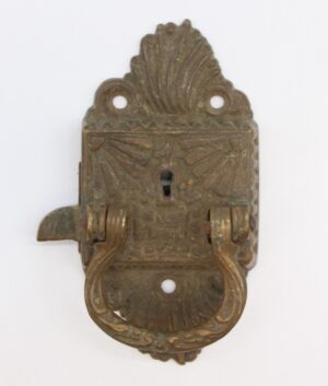 Antique bronze Art Nouveau right swing ice box latch with ornate embossed details, keyhole, and mounting holes, shown front view with the handle extended on the left side.