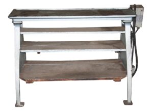 Cast iron lathe base with three shelves and a side-mounted control box, shown in a front view.