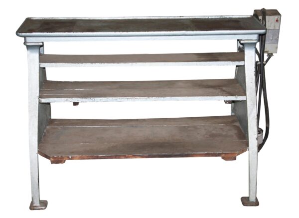 Cast iron lathe base with three shelves and a side-mounted control box, shown in a front view.