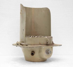 Gray metal industrial traffic light housing shown in a front view, with a curved top panel and mounting flange visible.