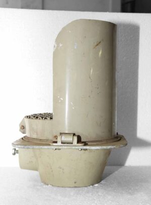 Gray metal industrial traffic light housing shown in a close-up side view with a rounded top and base mount.