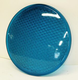 Round blue glass panel with a convex surface and textured grid pattern.