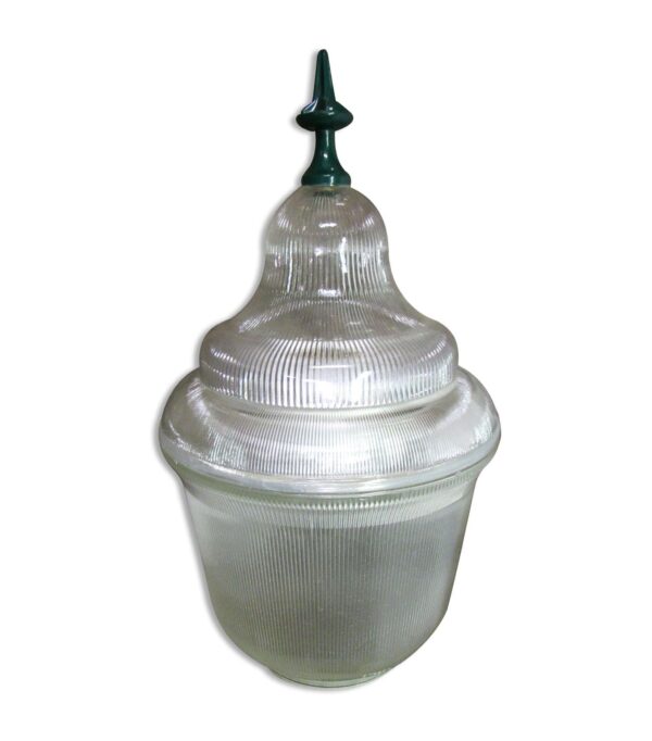 Clear ribbed glass street light globe with a tapered top and small green finial, shown as a single lighting fixture component.