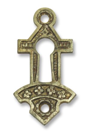 Ornate Eastlake keyhole cover plate with a round mounting hole and decorative cutout, shown front view.