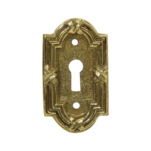 Brass arched rectangle door keyhole cover with a central keyhole opening and two screw holes.