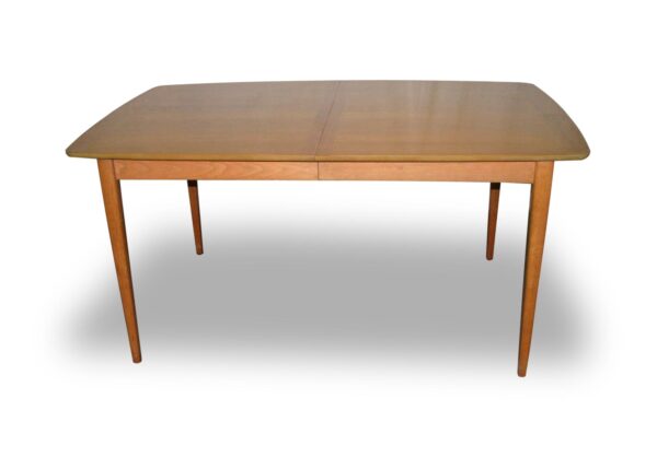 Mid-century modern dining table with a light wood tone and rectangular top, shown with tapered legs and a seam down the center of the surface.