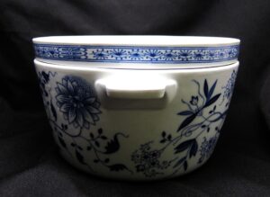 Blue and white ceramic soup pot with a matching lid and a floral pattern.