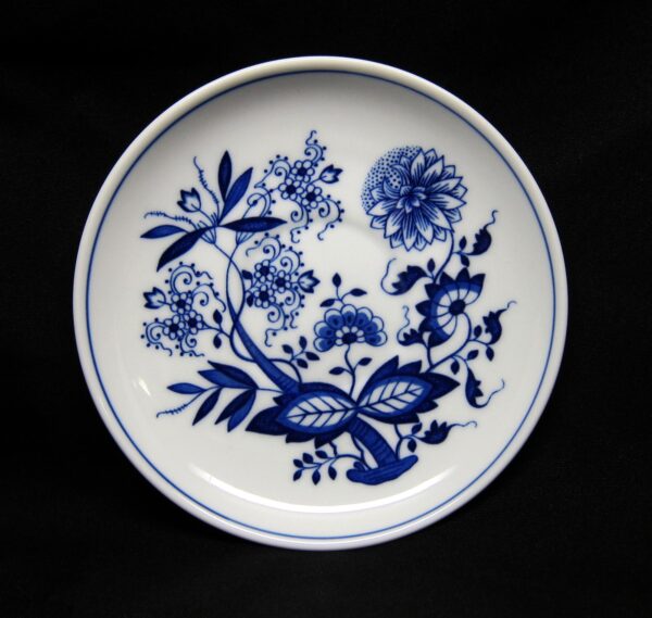 Round ceramic saucer plate with a blue floral pattern and double blue rim.