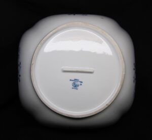 Bottom view of a ceramic vegetable bowl with a Hutschen Reuther maker mark and foot ring visible.