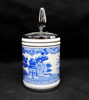 Ceramic shaker with blue and white oriental-style pattern and a chrome-colored metal top dispenser.