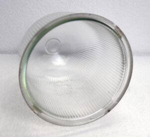 Clear glass domed Holophane globe shown from above, with a ribbed prismatic surface and circular opening at the center.