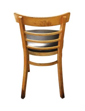 Vintage maple restaurant chair with a slatted back and black cushion seat, shown from the back.