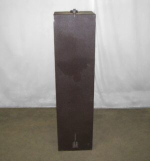 Tall narrow brown metal cabinet shown front on, with a small foot press visible near the bottom.