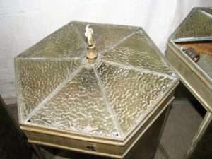 Hexagonal ceiling lantern with textured glass panels and a central hanging socket, shown from above with several panels missing.