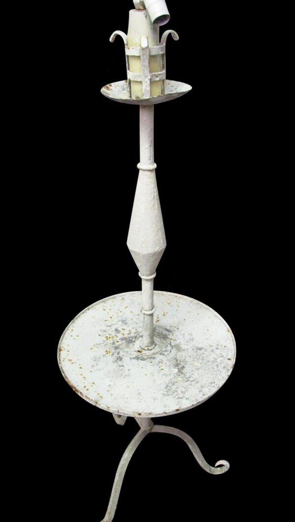 Vintage white metal lamp on a stand with a circular tray and tapered central column, shown full length.