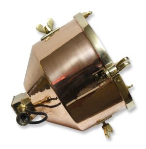 Replica nautical signal light with a copper finish and brass fittings shown at an angle, featuring a faceted glass lens and mounting hardware.