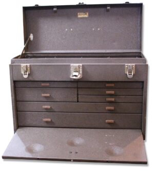 Open gray metal tool box with a flip top lid and multiple front drawers.