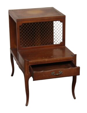 Vintage side table with a leather top, open lattice front, and a single drawer with metal handle.