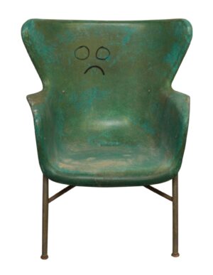 Vintage multicolored fiberglass chair with a worn seat and metal legs.